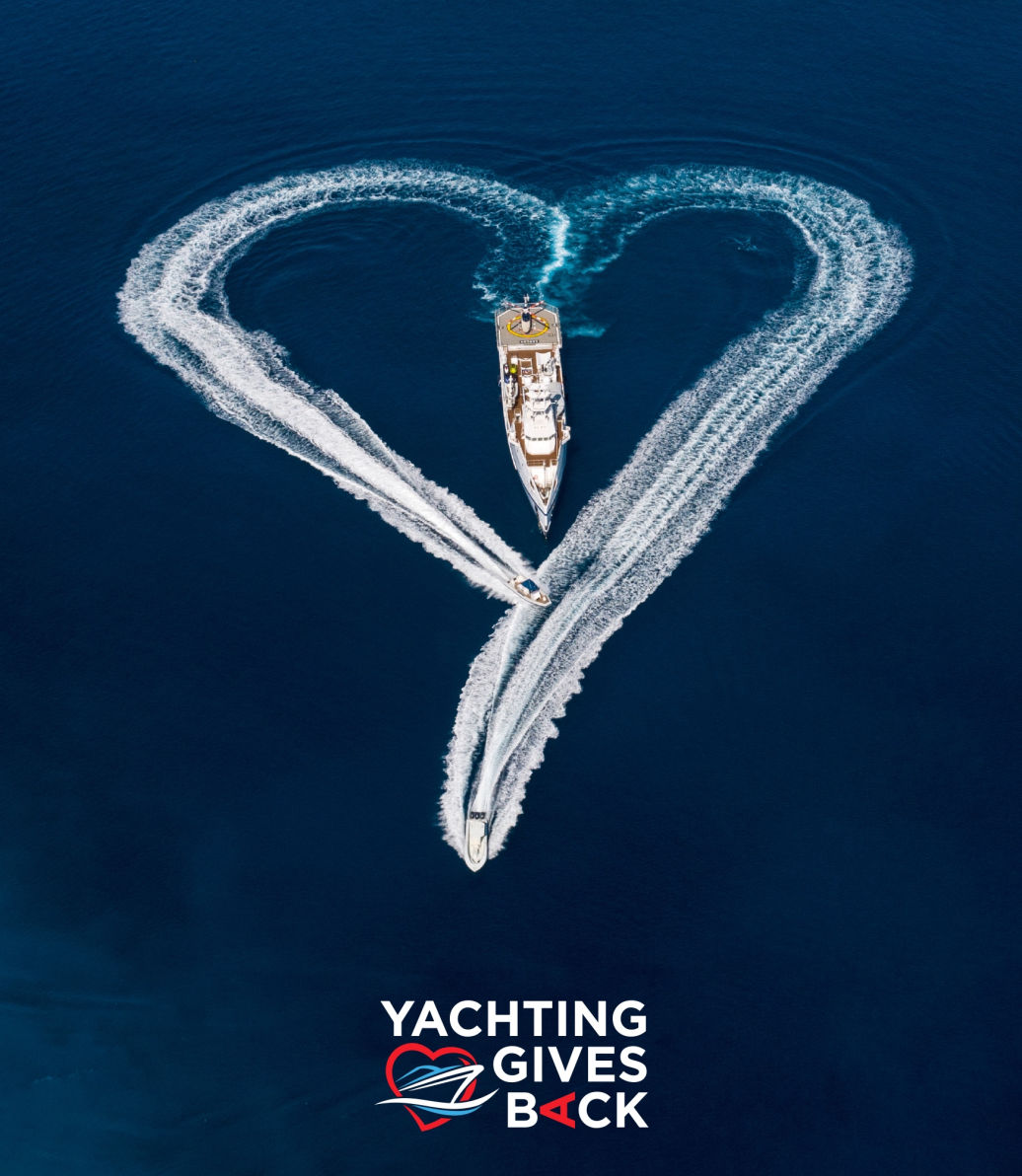 A motor yacht making a heart-shaped wake at sea