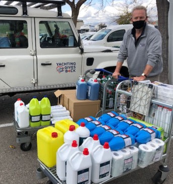 A man with two trolleys full of cleaning equipment