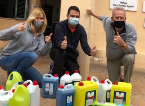 YGB volunteers show donated cleaning equipment