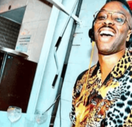 A smiling discjockey at work