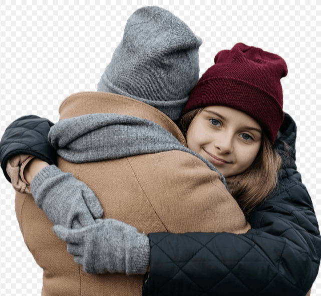 A woman and a young girl embrace each other