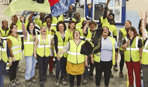 Joyful group of people waving at the camera