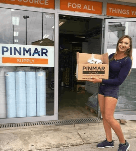 A woman holding a box of donated food