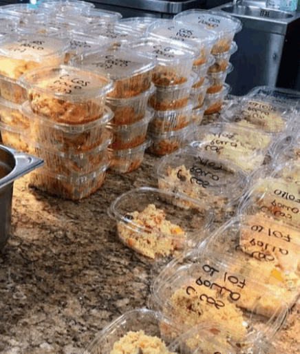 Food rations piled up on the worktop in a galley