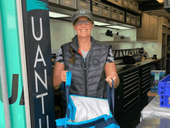  A woman offering a bag of donations