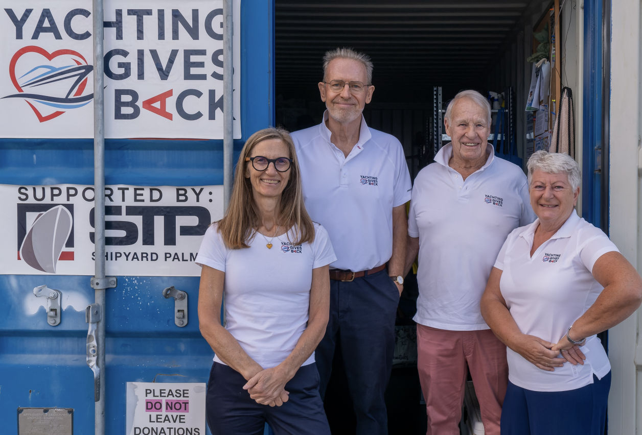 Yachting Gives Back team in front of the container